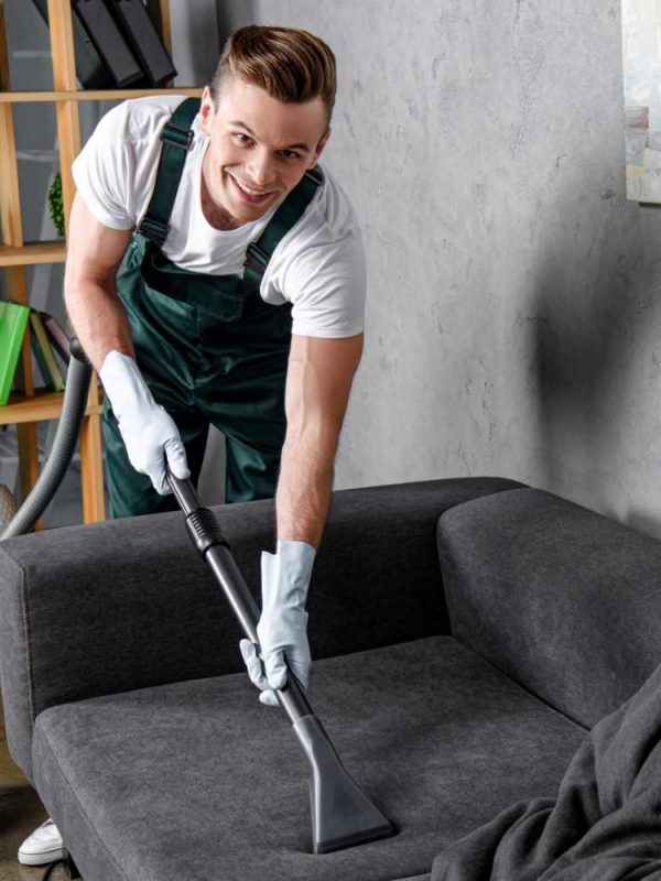 handsome-young-man-in-rubber-gloves-cleaning-furni-ZCFSTZN_2.jpg
